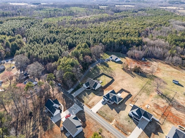 drone / aerial view with a view of trees