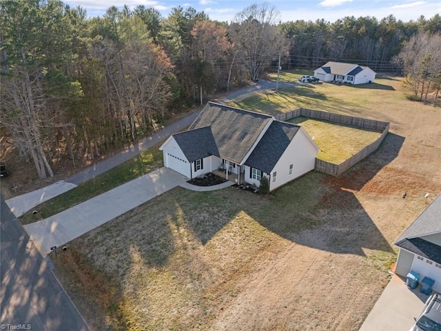 bird's eye view featuring a wooded view