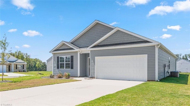 view of front of house featuring a garage and a front yard