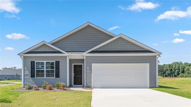 view of front facade featuring a garage and a front yard