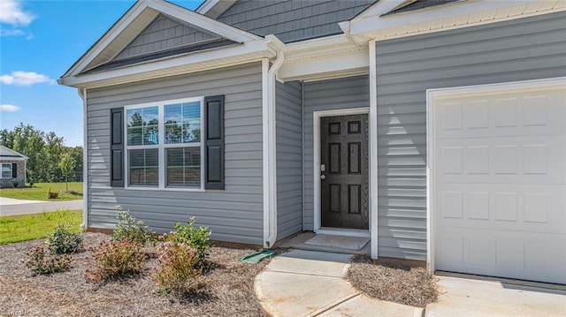 entrance to property featuring a garage