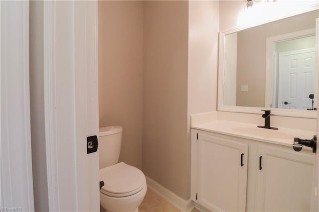 bathroom featuring toilet and vanity