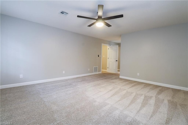 empty room with light colored carpet and ceiling fan