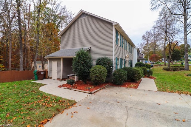 view of property exterior with a yard