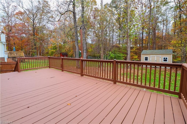 wooden deck featuring a storage shed