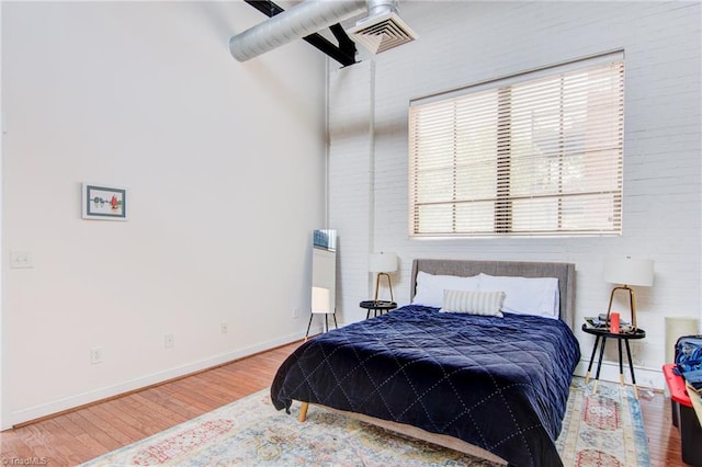 bedroom featuring hardwood / wood-style floors