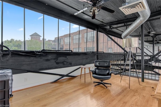 interior space with ceiling fan