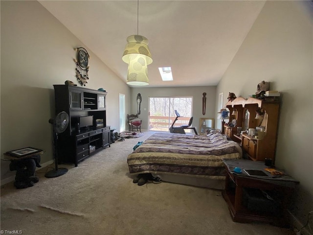 carpeted bedroom with lofted ceiling with skylight