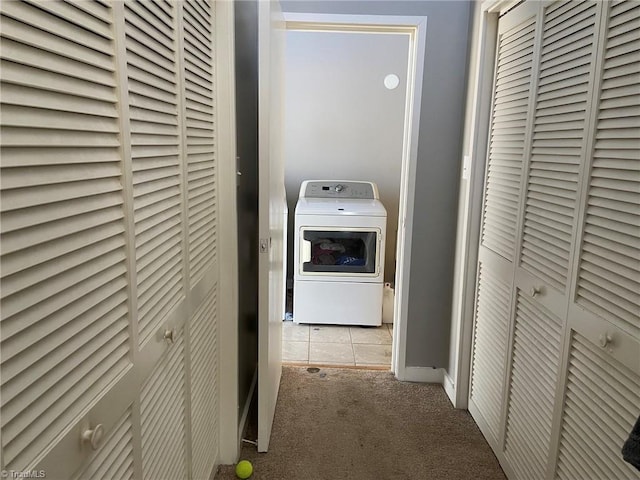 laundry area with carpet floors, washer / dryer, and laundry area