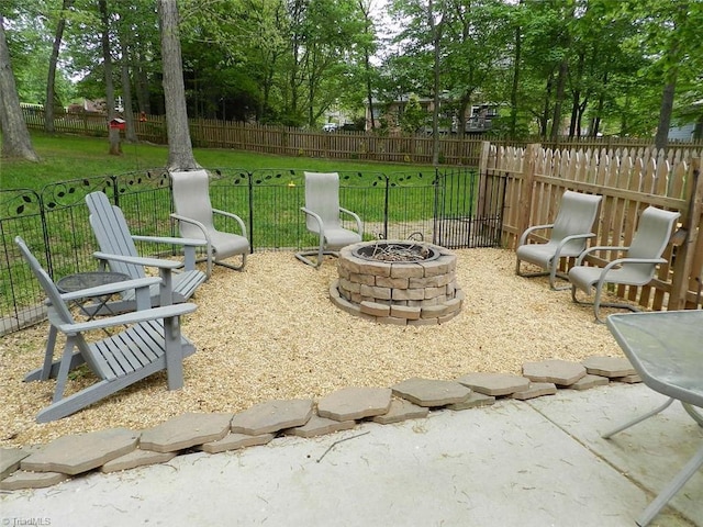 view of patio / terrace with an outdoor fire pit
