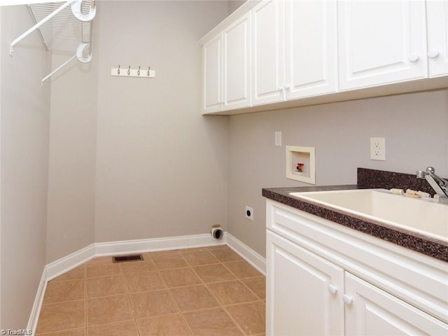 laundry area with washer hookup, hookup for an electric dryer, cabinet space, and baseboards