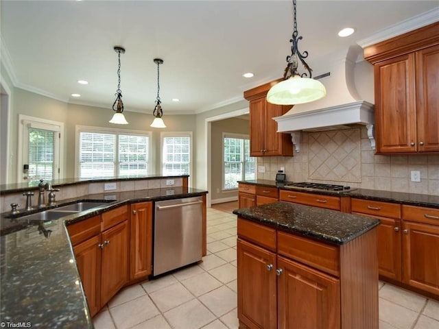 kitchen featuring stainless steel appliances, a sink, brown cabinets, recessed lighting, and ornamental molding