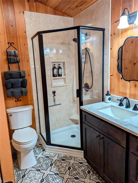 bathroom featuring vanity, lofted ceiling, tile patterned flooring, toilet, and an enclosed shower