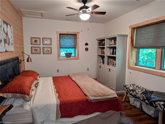 bedroom featuring ceiling fan and dark hardwood / wood-style floors