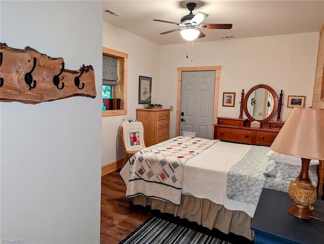 bedroom with ceiling fan and dark hardwood / wood-style flooring