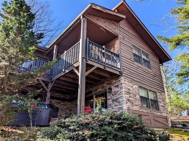 view of side of home featuring a deck