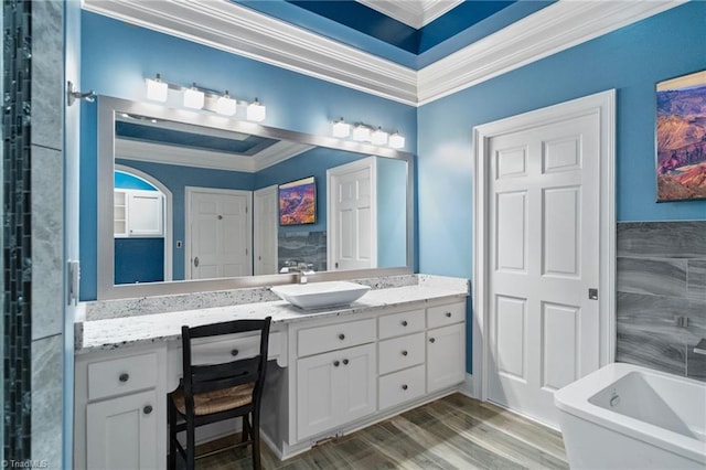 265 Phillip Henderson Rd, Rutherfordton, NC 28139 - bathroom featuring ornamental molding, a soaking tub, vanity, and wood finished floors