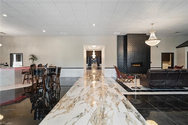 265 Phillip Henderson Rd, Rutherfordton, NC 28139 - kitchen featuring a fireplace, open floor plan, marble tiled floors, and recessed lighting