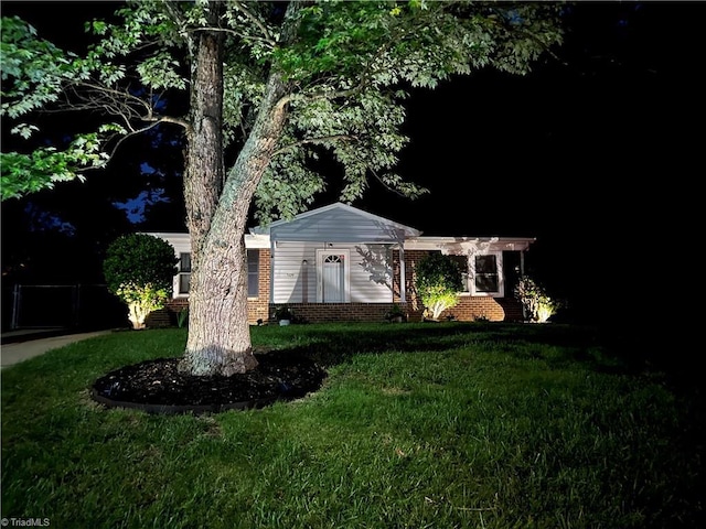 view of home's exterior featuring a lawn