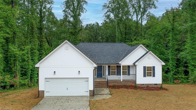 view of front of home featuring a front yard, a garage, and a porch