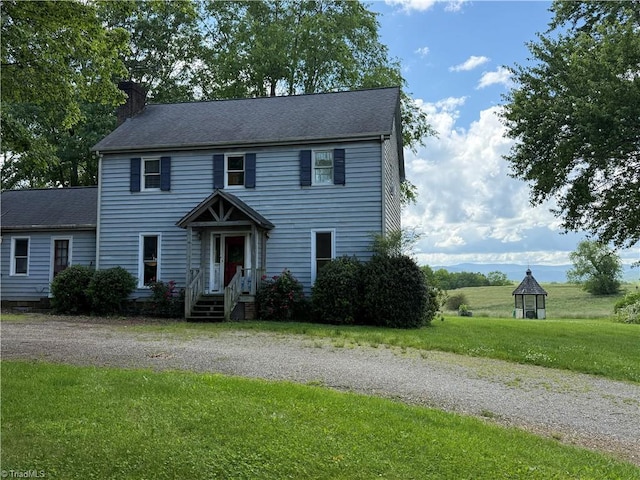 356 Hamby Mountain Rd, Purlear, NC 28665 - colonial inspired home with a chimney and a front yard