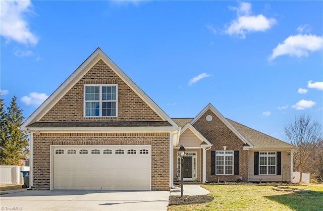 view of front of property with a garage and a front lawn