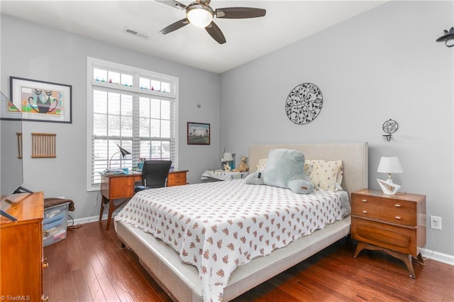 bedroom with ceiling fan and dark hardwood / wood-style flooring