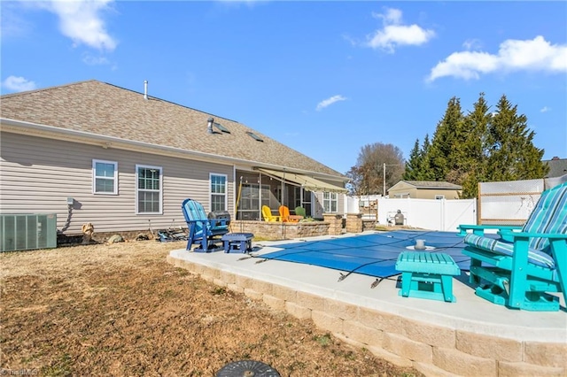 view of pool with a patio and central air condition unit