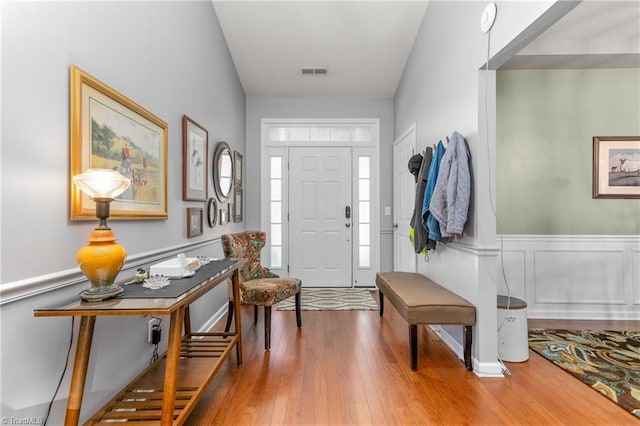 entryway with hardwood / wood-style floors