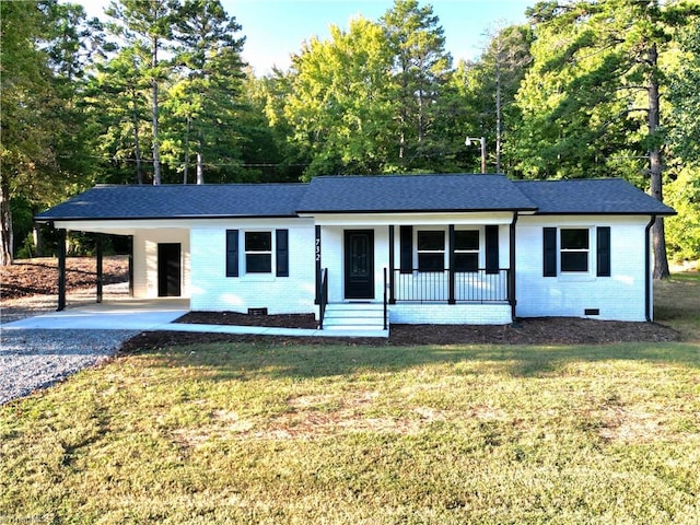 ranch-style home featuring a carport, a porch, and a front yard