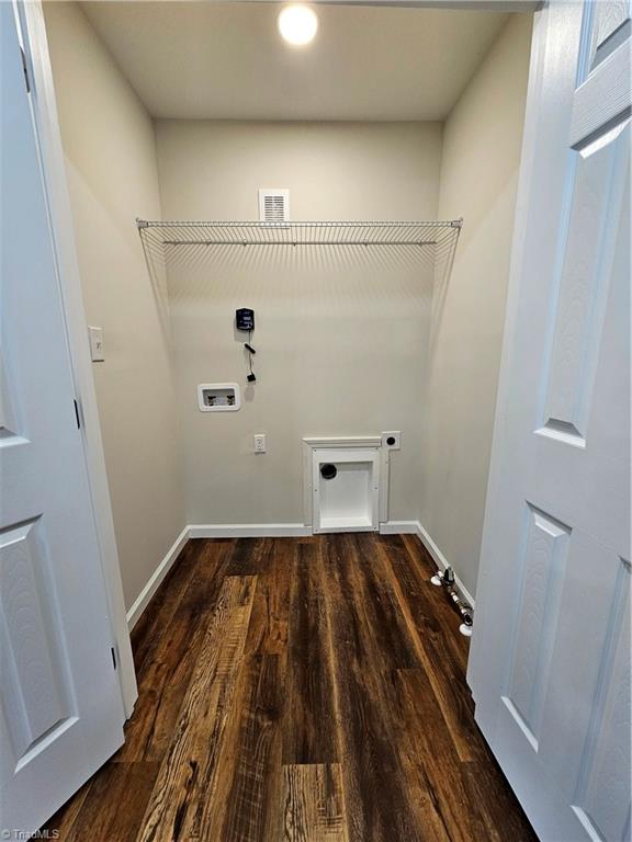 laundry area featuring hookup for a washing machine, dark hardwood / wood-style flooring, and hookup for an electric dryer