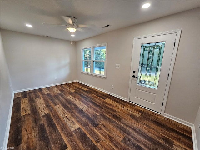 foyer entrance with ceiling fan and dark hardwood / wood-style flooring