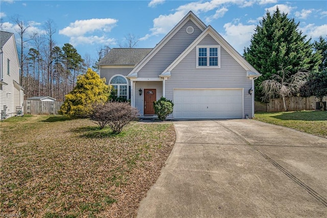 traditional-style house with concrete driveway, a front lawn, and fence