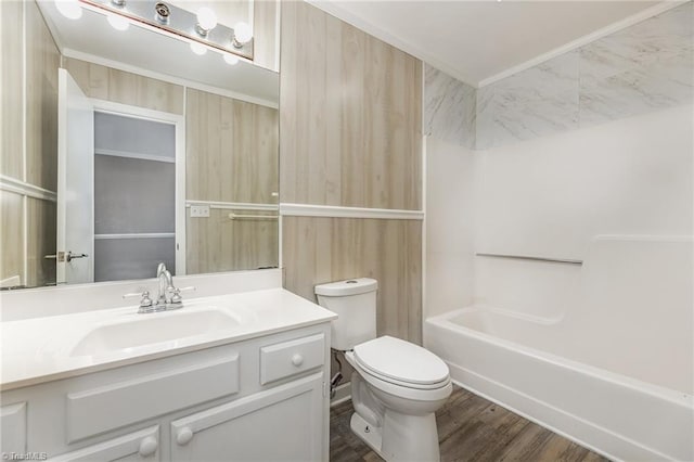 bathroom with shower / bathtub combination, vanity, toilet, and wood finished floors