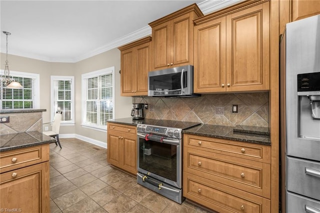 4455 Greystone Place Ct, Winston-Salem, NC 27106 - kitchen with appliances with stainless steel finishes, decorative backsplash, crown molding, brown cabinetry, and plenty of natural light