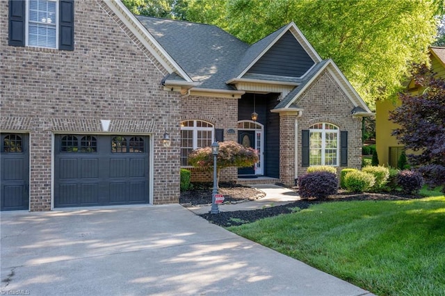 4455 Greystone Place Ct, Winston-Salem, NC 27106 - view of front of house featuring brick siding, driveway, a garage, a front lawn, and a shingled roof