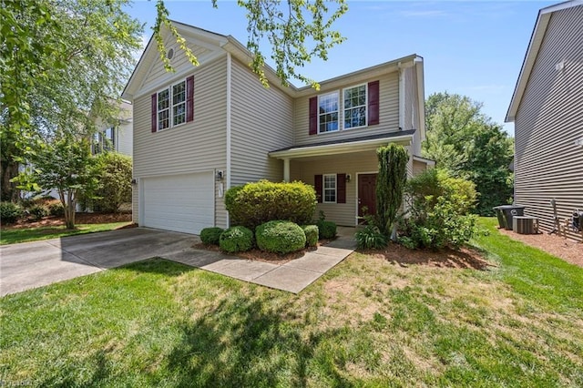 traditional-style house with an attached garage, concrete driveway, a front lawn, and central AC