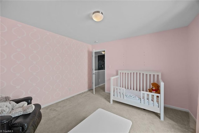 carpeted bedroom featuring baseboards and wallpapered walls