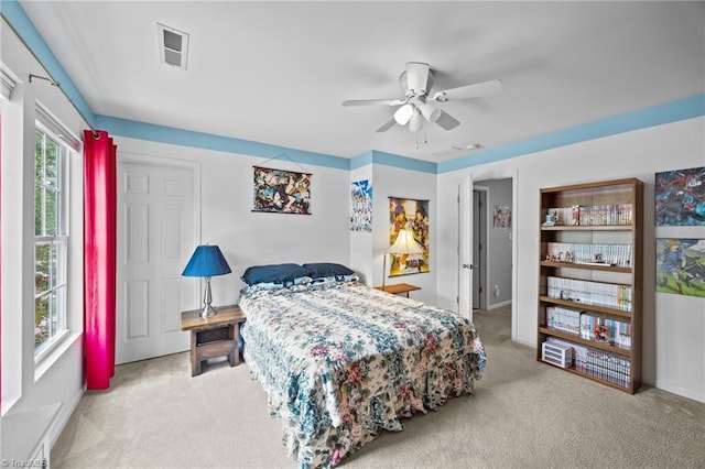 carpeted bedroom featuring ceiling fan and baseboards