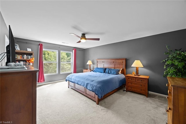 bedroom featuring carpet floors, ceiling fan, and baseboards
