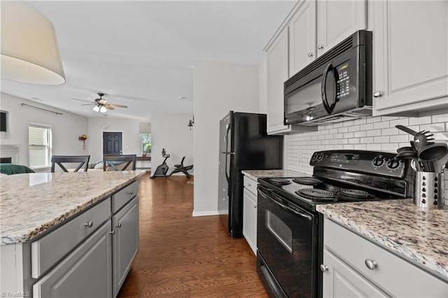 kitchen with black appliances, backsplash, ceiling fan, open floor plan, and healthy amount of natural light