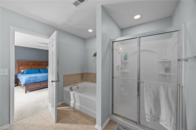full bathroom with a stall shower, tile patterned floors, a bath, baseboards, and ensuite bathroom