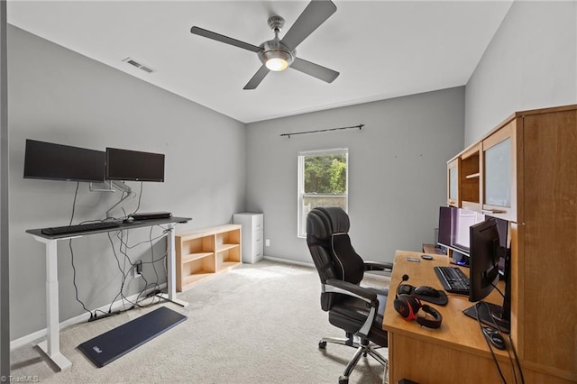 office with a ceiling fan, carpet flooring, and baseboards