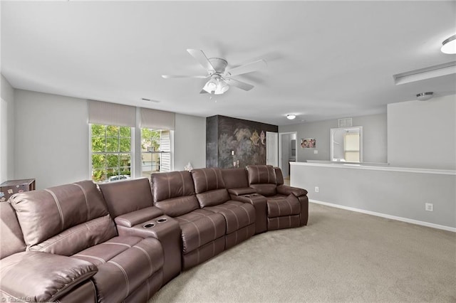 living room with light colored carpet, a ceiling fan, and baseboards