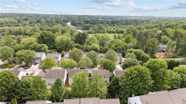 aerial view of residential area with a forest
