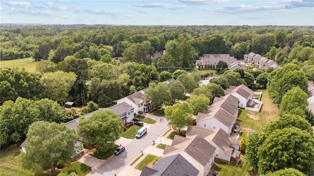 aerial view of residential area with a forest