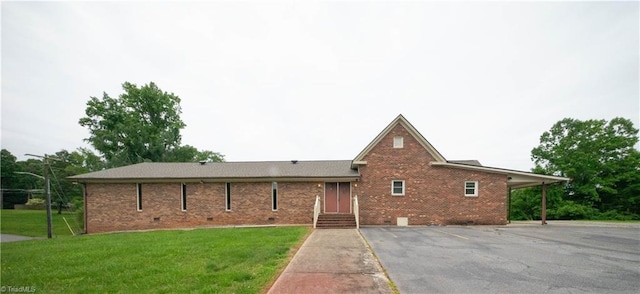 ranch-style home with a front yard