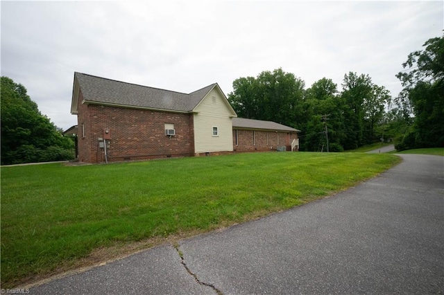 view of home's exterior featuring a yard