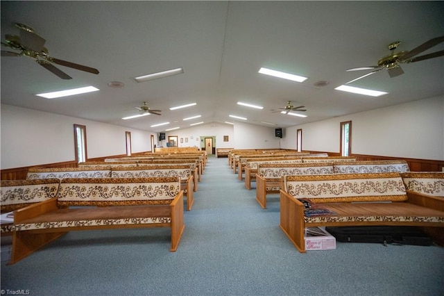 misc room with carpet and lofted ceiling