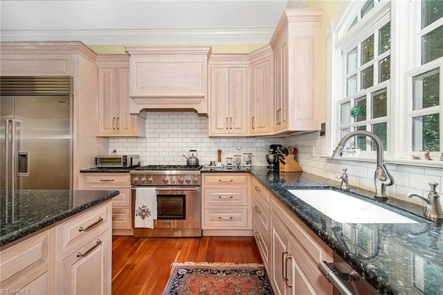 4432 Bent Tree Farm Rd, Winston-Salem, NC 27104 - kitchen featuring high end appliances, custom exhaust hood, wood finished floors, ornamental molding, and decorative backsplash